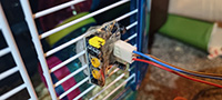 Motion sensor attached to cage